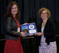 Mary Ann Sondrini of the Eagleson Institute presenting the Eagleson Lecture Series Award to Hazel Barton, PhD, 2017 ABSA International Conference