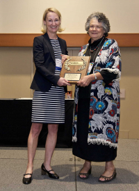 Maureen O’Leary, PhD, MBA, CBSP, presenting the Everett Hanel, Jr. Presidential Award to Dee Zimmerman, 2017 ABSA International Conference