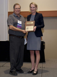 Maureen O'Leary presenting the Arnold G. Wedum Distinguished Achievement Award to Rebar, Richard, RBP, CBSP, 2017 ABSA International Conference